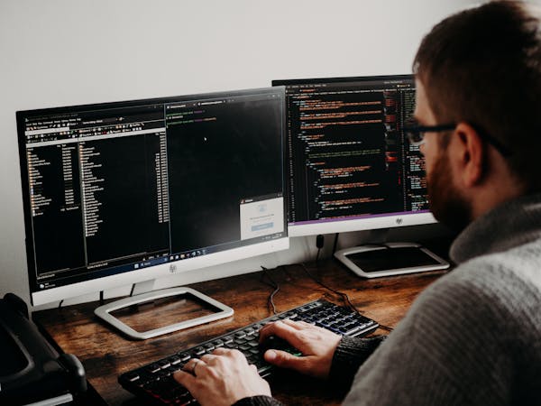free-photo-of-man-working-on-computers-coding
